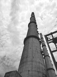 Low angle view of factory against sky