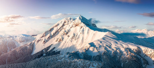 Scenic view of snowcapped mountains against sky