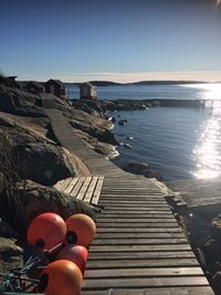Pier over sea against clear sky