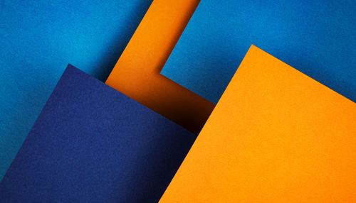 High angle view of paper against blue background