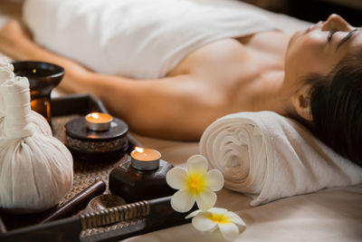 Midsection of women relaxing on floor