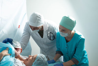 Rear view of man working at clinic