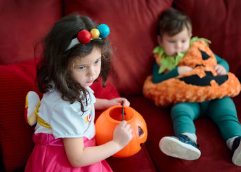 Brother and sister in their halloween costumes