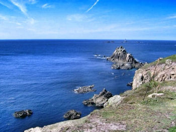 Scenic view of sea against blue sky