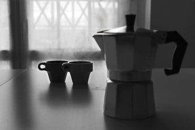 Close-up of coffee cup on table at home