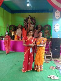 Woman standing against the wall