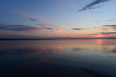 Scenic view of sea against romantic sky at sunset