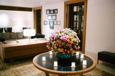 Flower vase on table at home