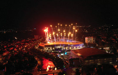 High angle view of illuminated buildings in city at night