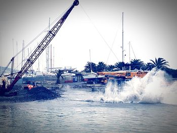 Boats moored at harbor