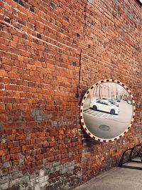 Reflection of car in a wall mirror 