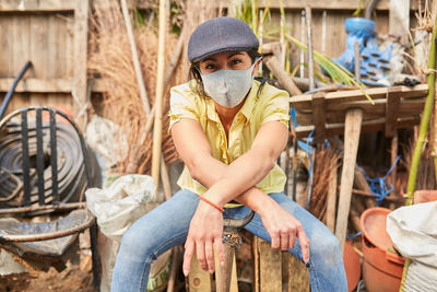 Portrait of woman working on wood