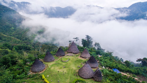 Scenic view of wae rebo village in flores indonesia surrounded by mountains