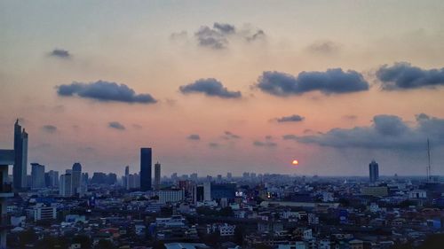 High angle view of buildings against sky during sunset