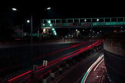 Light trails on road in city at night
