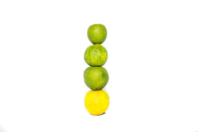 Close-up of fruits over white background