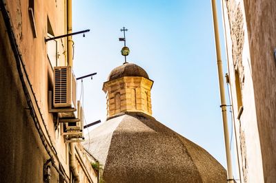 Low angle view of buildings against clear sky