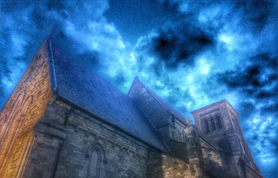 Low angle view of church against blue sky