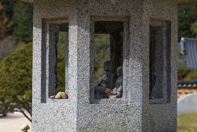 View of a stone tower in front of building