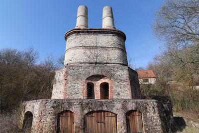 Low angle view of old building against sky