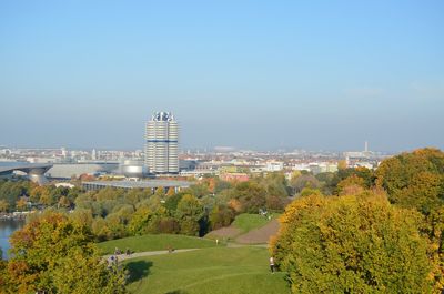 Trees and buildings against sky