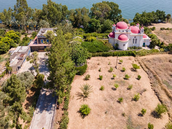 High angle view of trees by building in city