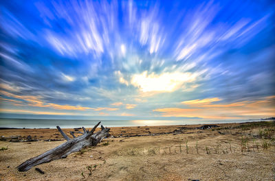 Scenic view of field against sky during sunset