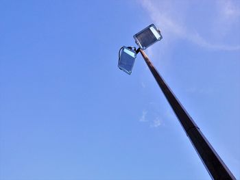 Low angle view of basketball hoop against blue sky