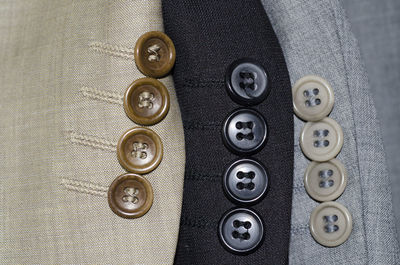 High angle close-up of shirt buttons