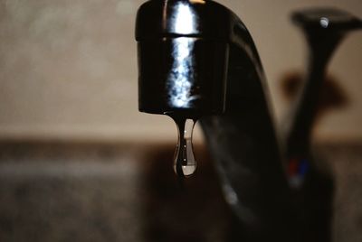 Close-up of water dripping from faucet