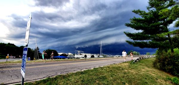 Road by city against sky