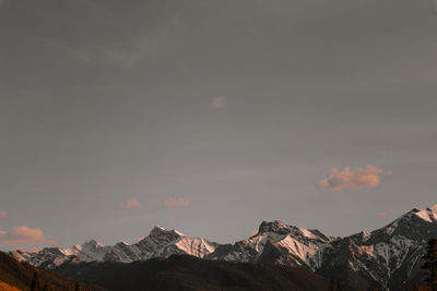 Panoramic view of snowcapped mountains against sky