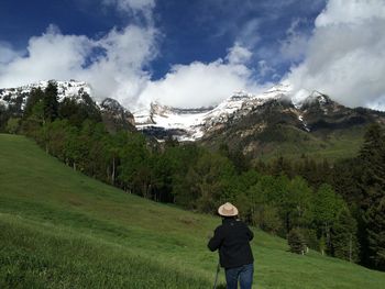 People standing on grassy field