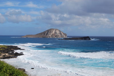 Scenic view of sea against cloudy sky