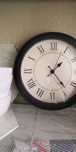 High angle view of clock on table