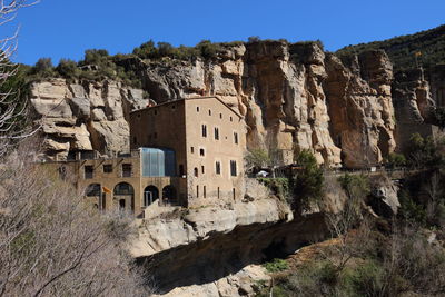 Old building at sant feliu de codines on sunny day