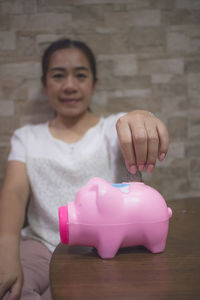 Portrait of smiling woman with pink face