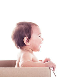 Portrait of cute boy against white background