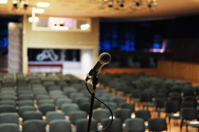Close-up of microphone in empty lecture hall