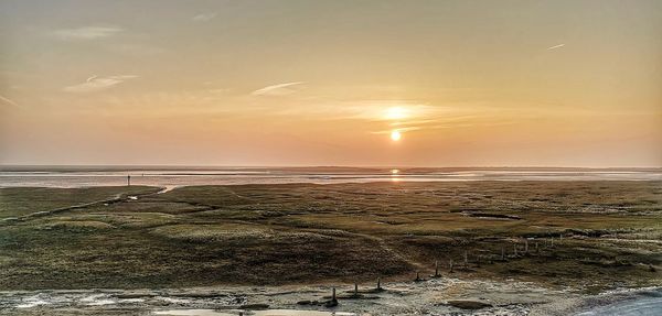 Scenic view of sea against sky during sunset