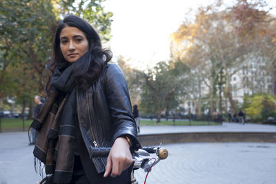 Portrait of a young woman in an urban park