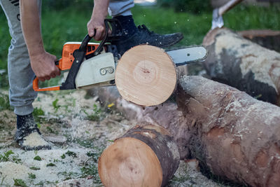 Low section of man working on wood