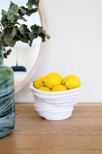 Close-up of fruits in basket on table