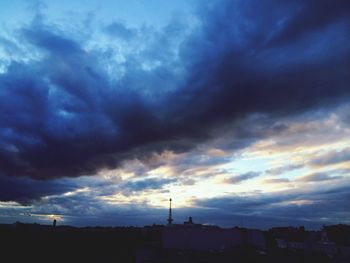 Low angle view of cloudy sky at sunset