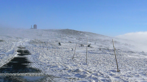 Scenic view of frozen landscape against clear sky