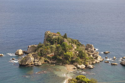 High angle view of rock by sea