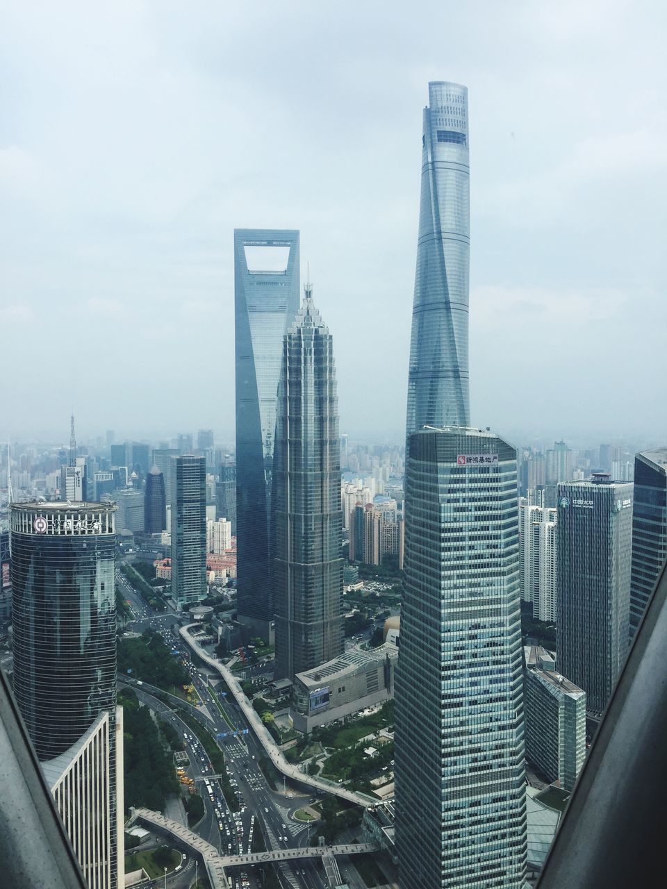 skyscraper, architecture, city, cityscape, modern, building exterior, built structure, sky, tower, development, urban skyline, travel destinations, downtown district, cloud - sky, high angle view, no people, tall, outdoors, day