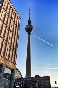 Low angle view of communications tower against clear sky