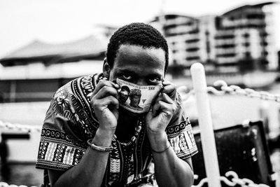 Close-up portrait of man holding paper currency