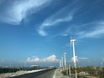 Road by street against sky